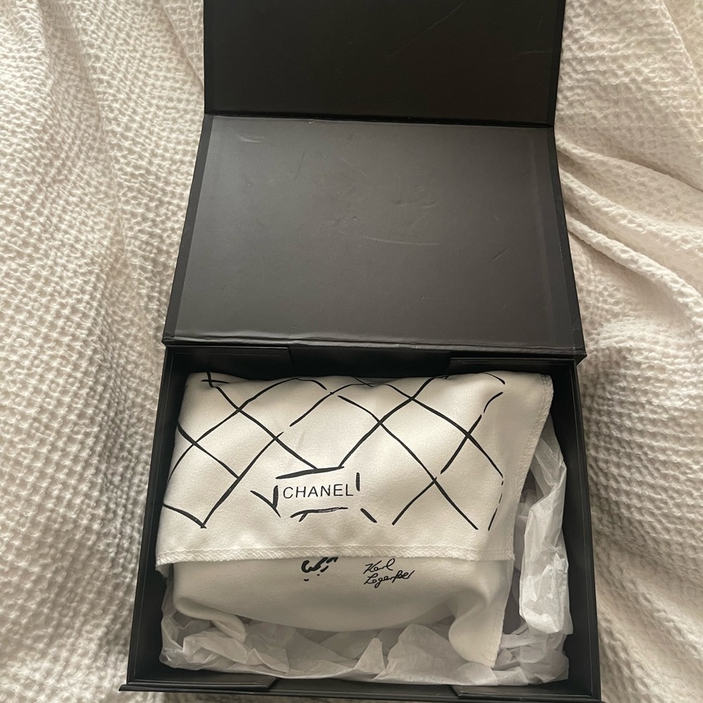 Authentic Chanel bag. White with gold detail.